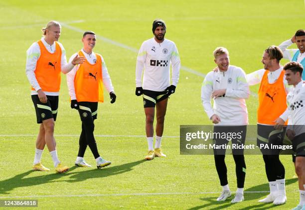 Manchester City's Erling Haaland , Phil Foden and Riyad Mahrez during a training session at the City Football Academy, Manchester. Picture date:...