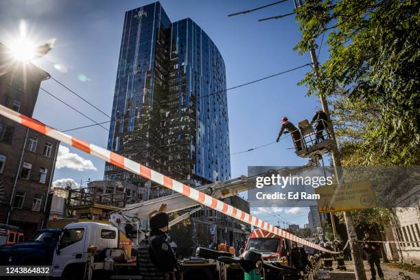 Emergency services personnel attend the site of a blast on October 10, 2022 in Kyiv, Ukraine. This morning's explosions, which came shortly after...