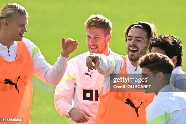 Manchester City's Norwegian striker Erling Haaland, Manchester City's Belgian midfielder Kevin De Bruyne and Manchester City's English midfielder...