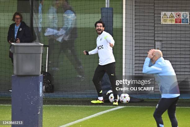 Manchester City's Spanish manager Pep Guardiola reacts as he attends a team's training session at Manchester City training ground in Manchester on...