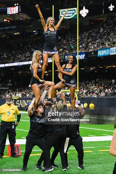 Saints cheerleaders rev up the crowd during the football game between the Seattle Seahawks and New Orleans Saints at Caesars Superdome on October 9,...