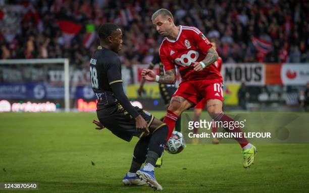 Charleroi's Ken Nkuba Tshiend and Standard's Aron Donnum fight for the ball during a soccer match between Sporting Charleroi and Standard Liege,...