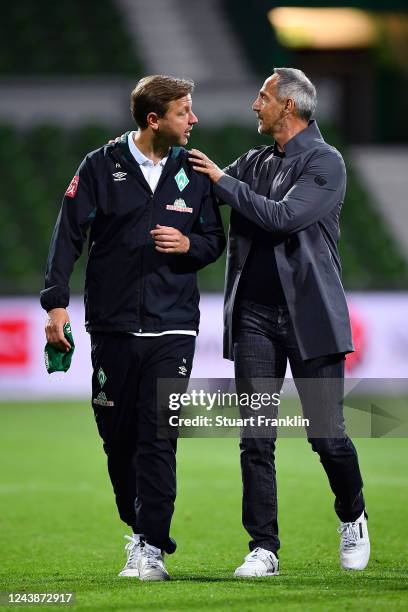 Florian Kohfeldt, Head Coach of SV Werder Bremen is consoled by Adolf Hutter, Head Coach of Eintracht Frankfurt after the Bundesliga match between SV...