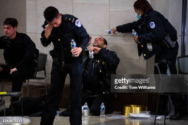 Capitol Police officers receive medical treatment in the crypt of the U.S. Capitol after clashes with protesters who later broke in and disrupted the...
