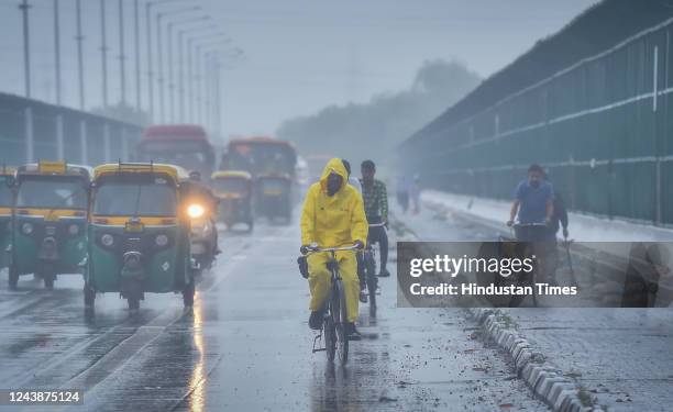 Commuters out on a rainy morning at ITO Bridge, Viksa Marg, on October 10, 2022 in New Delhi, India. Delhi has recorded 121.7 mm of rainfall in...