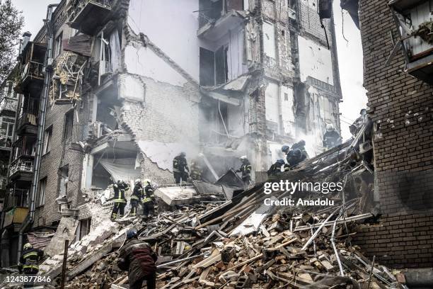 Firefighters conduct work in a damaged building after Russian missile attack in Zaporizhzhia, Ukraine on October 10, 2022. Today, the head of the...