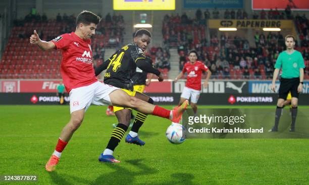 Tunay Deniz of Halle challenges Jayden Braaf of Dortmund during the 3.Liga match between Hallescher FC and Borussia Dortmund II at...
