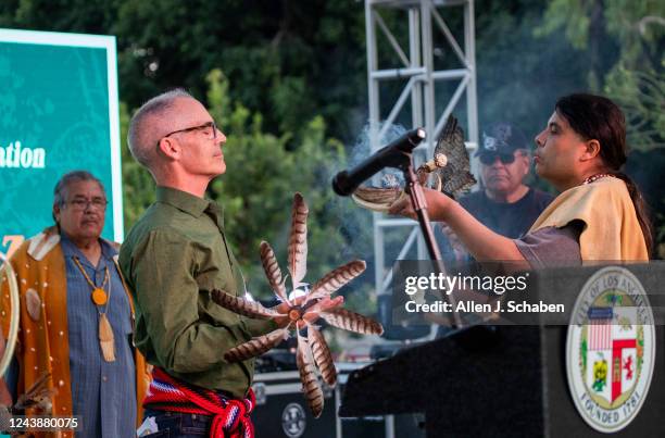 Los Angeles, CA Los Angeles City Councilmember Mitch OFarrell, left, holds the Tongva Ceremonial Staff during a celebration of Indigenous Peoples Day...