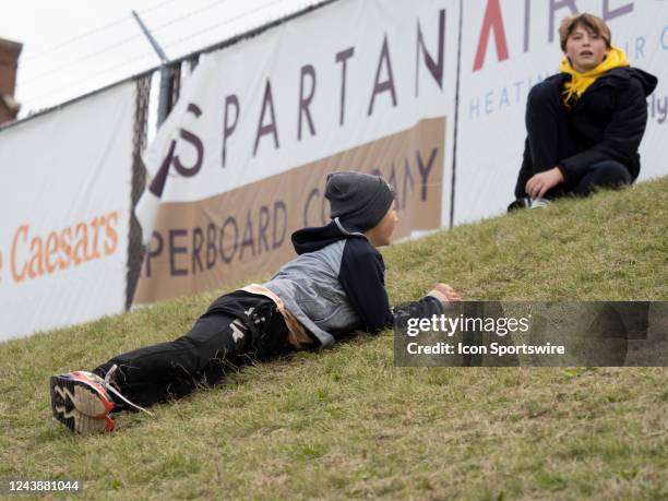 Young child plays on the hill during the college football game between the Eastern Michigan Eagles and Western Michigan Broncos on October 08 at...