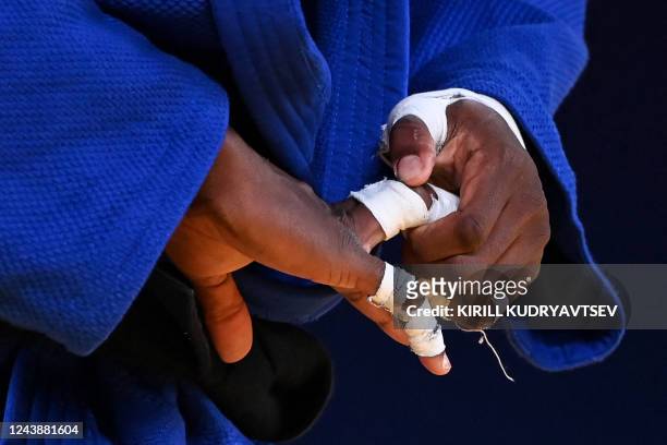 France's Kenny Liveze competes against Turkey's Mert Sismanlar in their men's under 100 kg category elimination round bout during the 2022 World Judo...