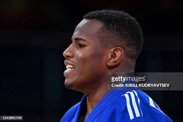 France's Kenny Liveze reacts as he competes against IJF refugee team's Adnan Khankan in their men's under 100 kg category elimination round bout...
