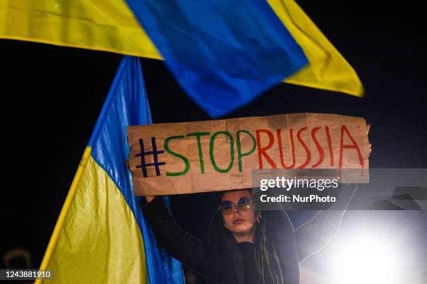Ukrainian citizens and supporters attend a demonstration of solidarity with Ukraine at the Main Square, after latest Russian missiles targeted...