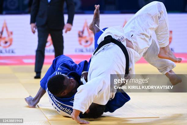 France's Kenny Liveze and IJF refugee team's Adnan Khankan compete in their men's under 100 kg category elimination round bout during the 2022 World...