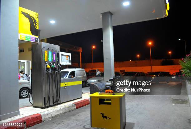 Tunisian with their cars queue in front of a fuel station Since 09 October long lines of cars have lined up outside petrol stations in the capital...