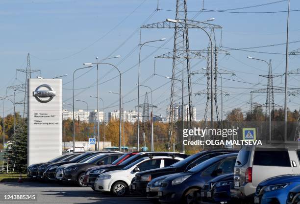 Car are seen at a parking lot of a Nissan factory on the outskirts of Saint Petersburg on October 11, 2022. Japanese automaker Nissan will sell its...