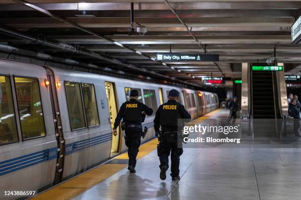 San Francisco Police officers inside the Bay Area Transit Embarcadero station in San Francisco, California, US, on Monday, Oct. 10, 2022. San...