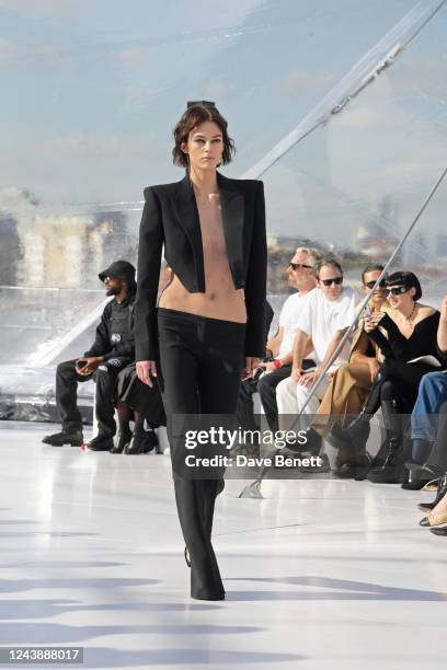 Model walks the runway at the Alexander McQueen SS23 Womenswear show at the Old Royal Naval College on October 11, 2022 in Greenwich, England.