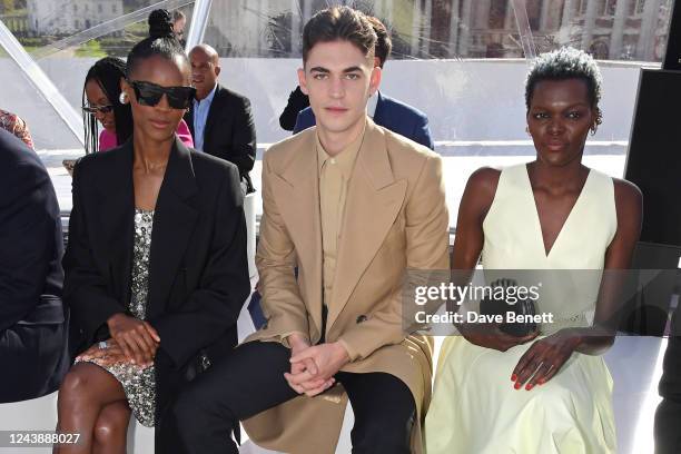 Letitia Wright, Hero Fiennes-Tiffin and Sheila Atim attend the Alexander McQueen SS23 Womenswear show at the Old Royal Naval College on October 11,...