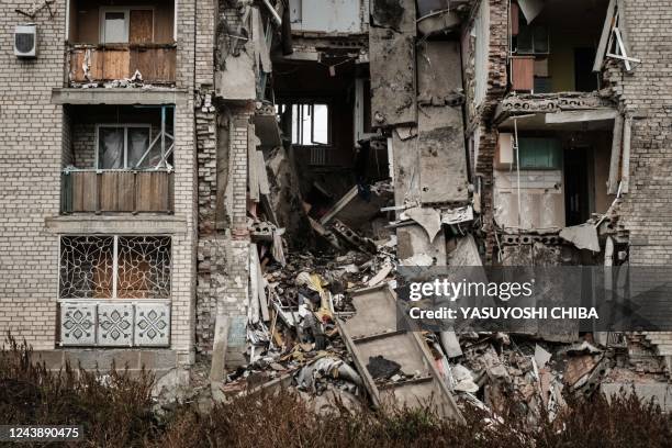 Destroyed apartment remains in the frontline town of Bakhmut in the Donetsk region on October 11 amid the Russian invasion of Ukraine. - This week's...