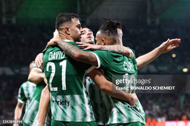 Maccabi Haifa's players celebrate their second goal during the UEFA Champions League group H football match between Israel's Maccabi Haifa and...