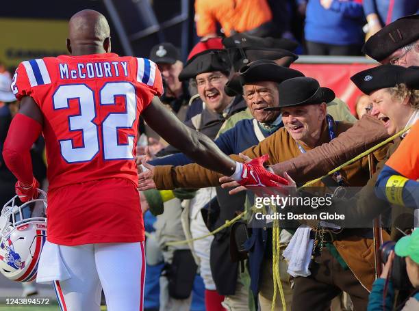 Foxborough, MA New England Patriots S Devin McCourty high fives the End Zone Militia after the Patriots defeated the Detroit Lions 29-0.