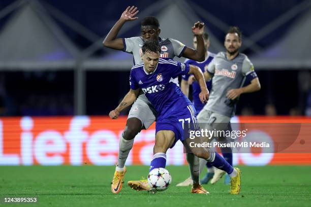 Dario Spikic of Dinamo Zagreb in action Lucas Gourna Douath of RB Salzburg during the UEFA Champions League group E match between Dinamo Zagreb and...