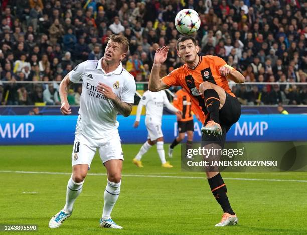 Real Madrid's German midfielder Toni Kroos and Shakhtar Donetsk's Ukrainian midfielder Taras Stepanenkovie for a header during the UEFA Champions...