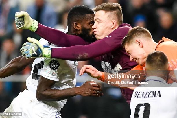 Antonio Rudiger of Real Madrid and Anatolii Trubin of Shakhtar Donetsk goal and injured during the UEFA Champions League group F match between...