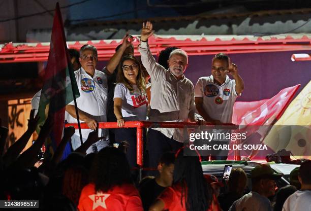 Brazil's former president and presidential candidate for the leftist Workers Party , Luiz Inacio Lula da Silva waves at supporters during a campaign...