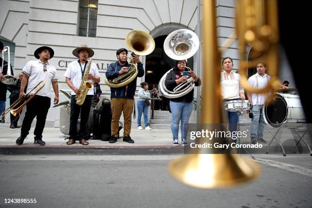 Traditional Oaxaqueña band plays while protestors block Main Street while the Los Angeles City Council meeting is in session at Los Angeles City Hall...