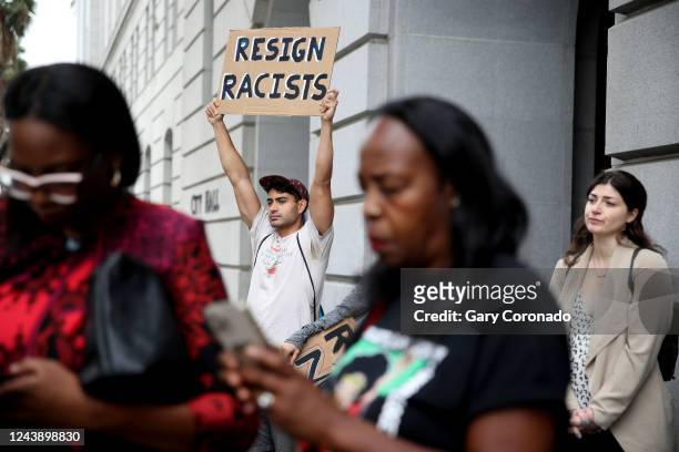 Francisco Espinosa, of Los Angeles, left, and other protestors in front of Los Angeles City Hall on Tuesday, Oct. 11, 2022 in Los Angeles, CA....