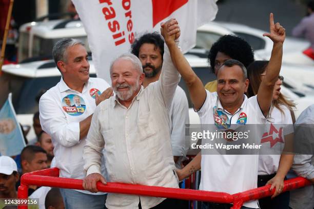 Former president of Brazil and candidate of Workers Party Luiz Inacio Lula Da Silva waves supporters next to Waguinho mayor of the Belford Roxo city...