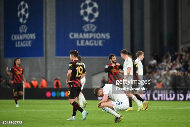 Copenhagen players and Manchester City players react after the UEFA Champions League football match between FC Copenhagen and Manchester City at...