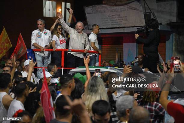 Brazil's former president and presidential candidate for the leftist Workers Party , Luiz Inacio Lula da Silva, waves at supporters during a campaign...