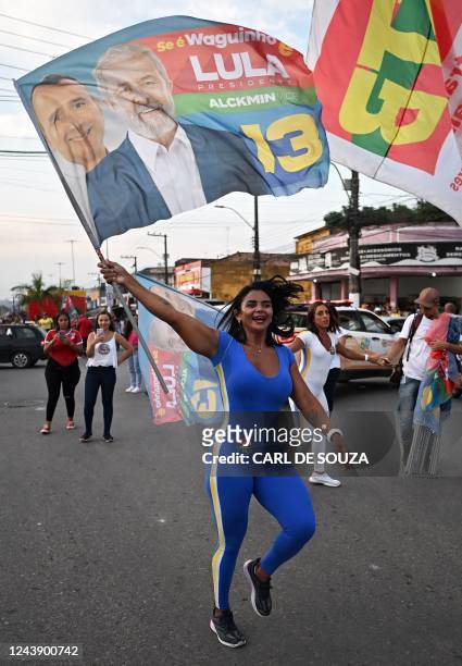 Supporter of Brazil's former president and presidential candidate for the leftist Workers Party , Luiz Inacio Lula da Silva cheers during a campaign...