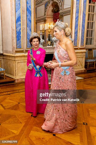 Queen Silvia of Sweden and Queen Maxima of The Netherlands during the state banquet at the first day of the Dutch State visit to Sweden on October...