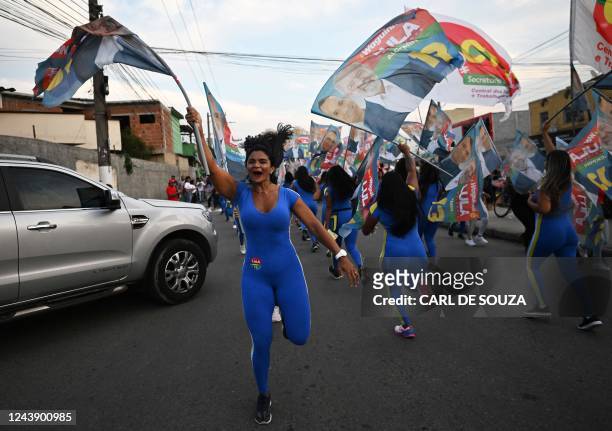 Supporters of Brazil's former president and presidential candidate for the leftist Workers Party , Luiz Inacio Lula da Silva cheer during a campaign...