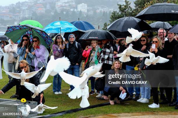 Doves are released during a commemoration ceremony to mark the 20th anniversary of the Bali bombings, at Coogee Beach in Sydney on October 12, 2022.