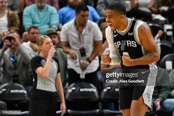 Keldon Johnson of the San Antonio Spurs reacts to a play during a game against the Utah Jazz at Vivint Arena on October 11, 2022 in Salt Lake City,...