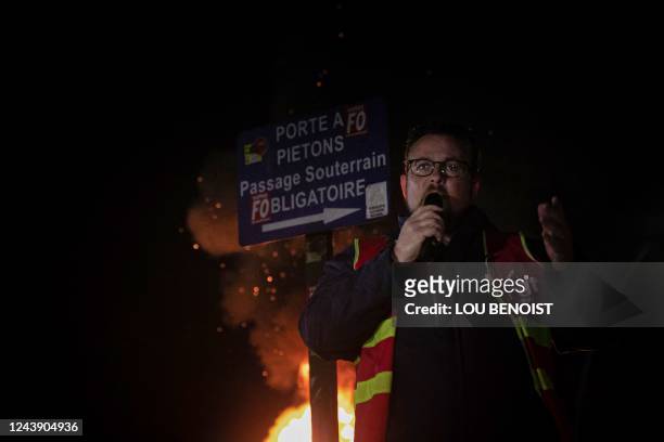 ExxonMobil CGT trade union secretary Germinal Lancelin speaks as trade unionists and employees gather in front of the ExxonMobil site in...