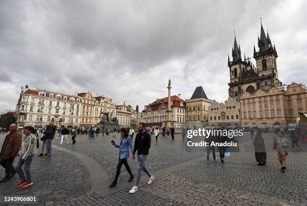 People are seen walking around in Old Town Square in the capital of Czech Republic, Prague on October 4, 2022. Czechia's capital, Prague, takes...