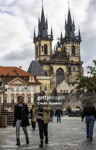 People are seen walking around a square surrounded by historic buildings in the capital of Czech Republic, Prague on October 5, 2022. Prague, the...