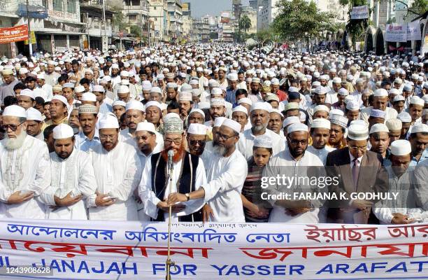 Activists and supporters of Bangladeshi Islamic fundamentalist party Jamat-e-Islami offer prayers for the late Palestinian leader Yasser Arafat in...