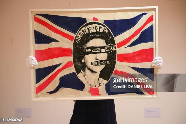 British artist, Jamie Reid's "God Save the Queen", a promotional poster, owned by Sid Vicious, is displayed in London on October 12 as part of the...