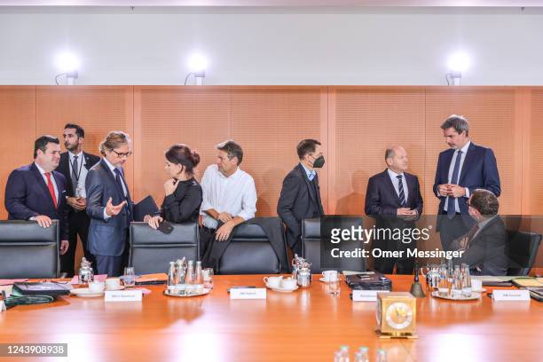 View of Government cabinet members speak to one another before the weekly government cabinet meeting, with German Federal Minister of Labor and...