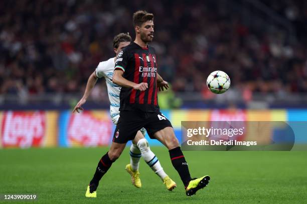 Matteo Gabbia of AC Milan controls the ball during the UEFA Champions League group E match between AC Milan and Chelsea FC at Giuseppe Meazza Stadium...