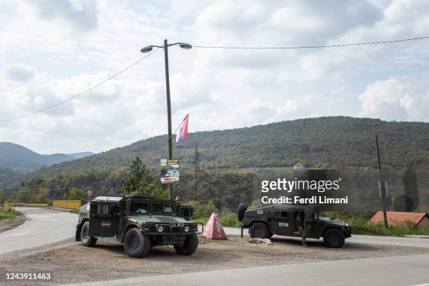 October 12: NATO led soldiers from the Republic of Latvia patrol at a crossroad near northern Kosovo town of Leposavic on October 12, 2022 in...