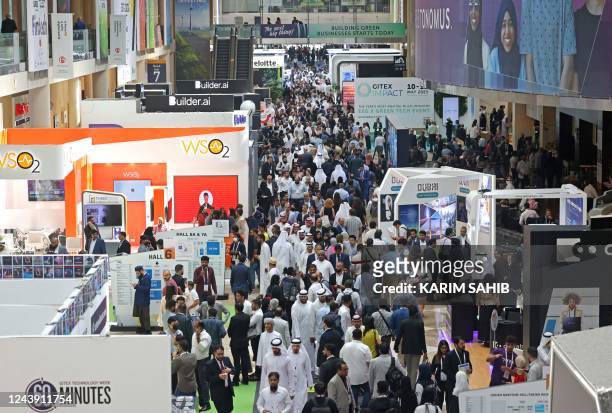 Visitors attend the GITEX Global technology show at the Dubai World Trade Centre in the Gulf emirate, on October 12, 2022.