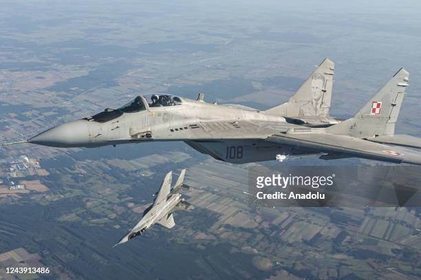 Raftor F22 from US Air Force, F 16 fighter jets and MIG 29 of the Polish Air Force take part in a NATO Air Force military drill on October 12, 2022...