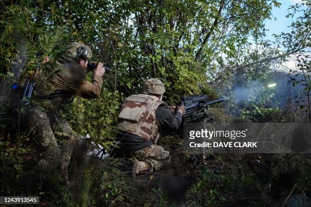 Soldier of Ukraine's 5th Regiment of Assault Infantry fires a US-made MK-19 automatic grenade launcher towards Russian positions in less than 800...